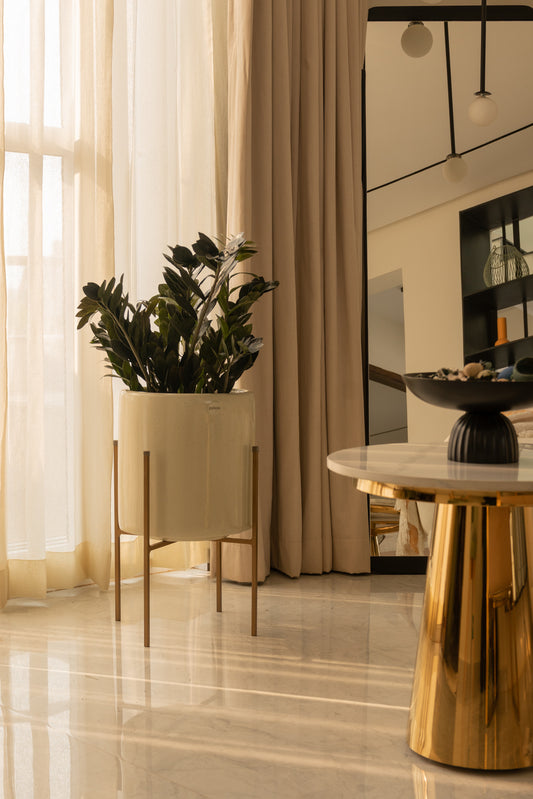 Cream beige planter pot online with metal stand. This modern planter pot with metal stands makes it easy to clean. Indoor pots for living room. Indoor plant pots for home.