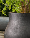 The Black Zuri round FRP Planter by Palasa is an ideal fit for classic and contemporary residences and gardens. This Large plant pot can be used indoors and outdoors.