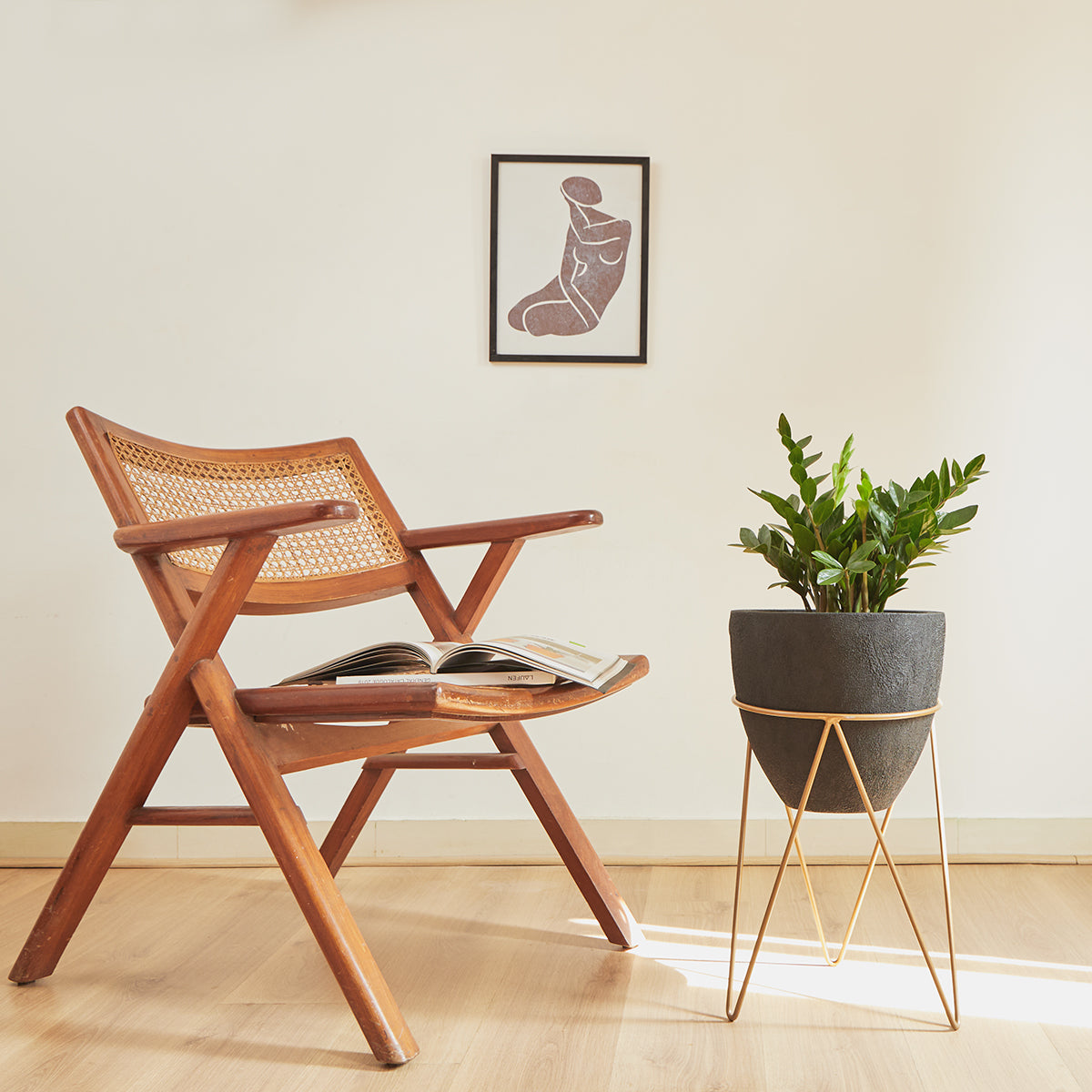 This fiberglass black planter with gold stand designed by Studio Palasa is an ideal fit for your indoor spaces like your entryway or any corner of your home or office space. Combined with the stand, the planter adds a dramatic effect onto your plants. 