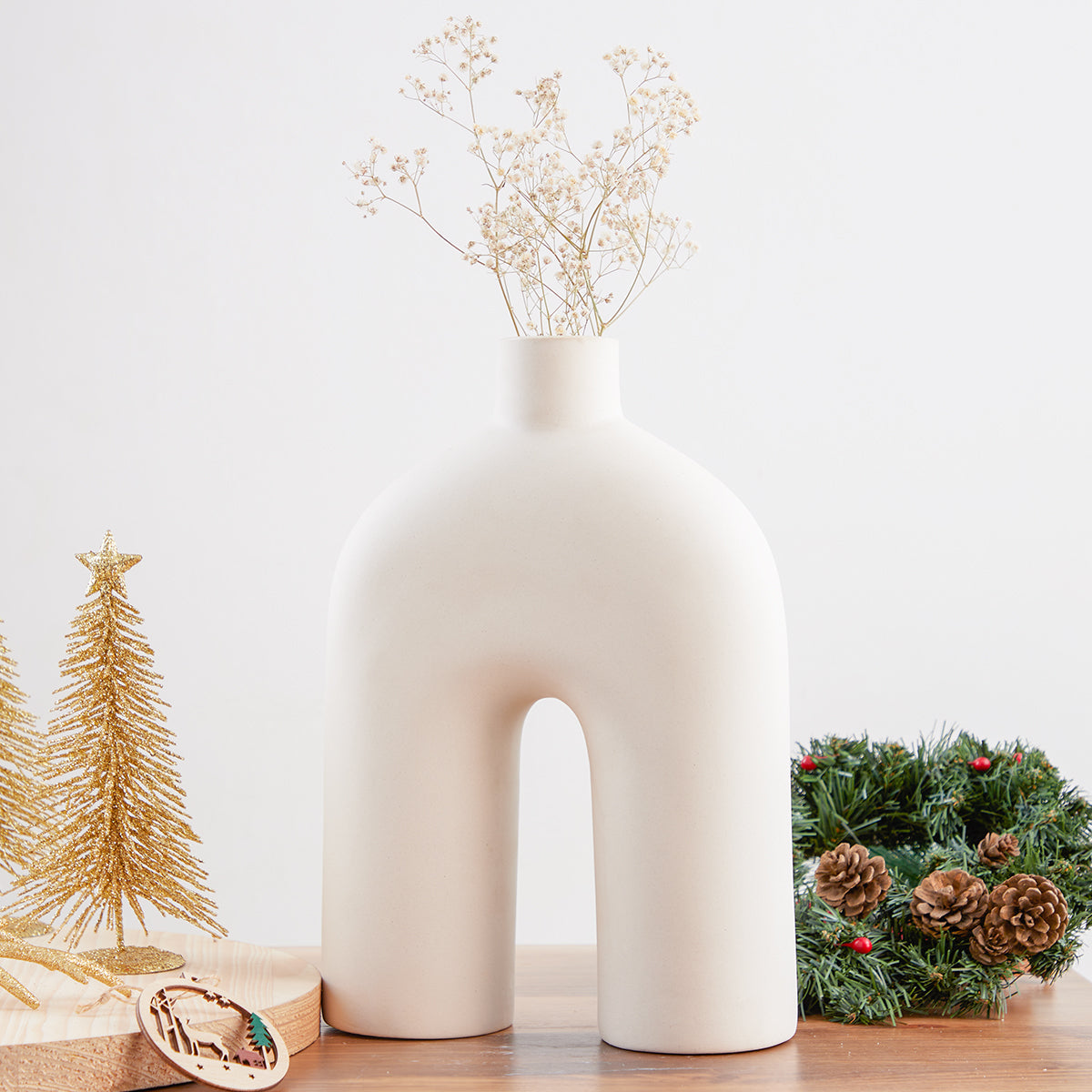 The Bridge Nordic White Ceramic Vase from Studio Palasa is a masterful addition to any room. 