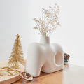 Crafted with a keen eye for Nordic design principles, our white Nordic vase embodies the essence of clean lines, sleek forms, and a pristine color palette. Its minimalist silhouette ensures that it seamlessly integrates into diverse decor styles, making it a perfect addition to modern, Scandinavian, or eclectic interiors.