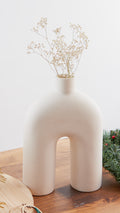 The Bridge Nordic White Ceramic Vase from Studio Palasa is a masterful addition to any room. .